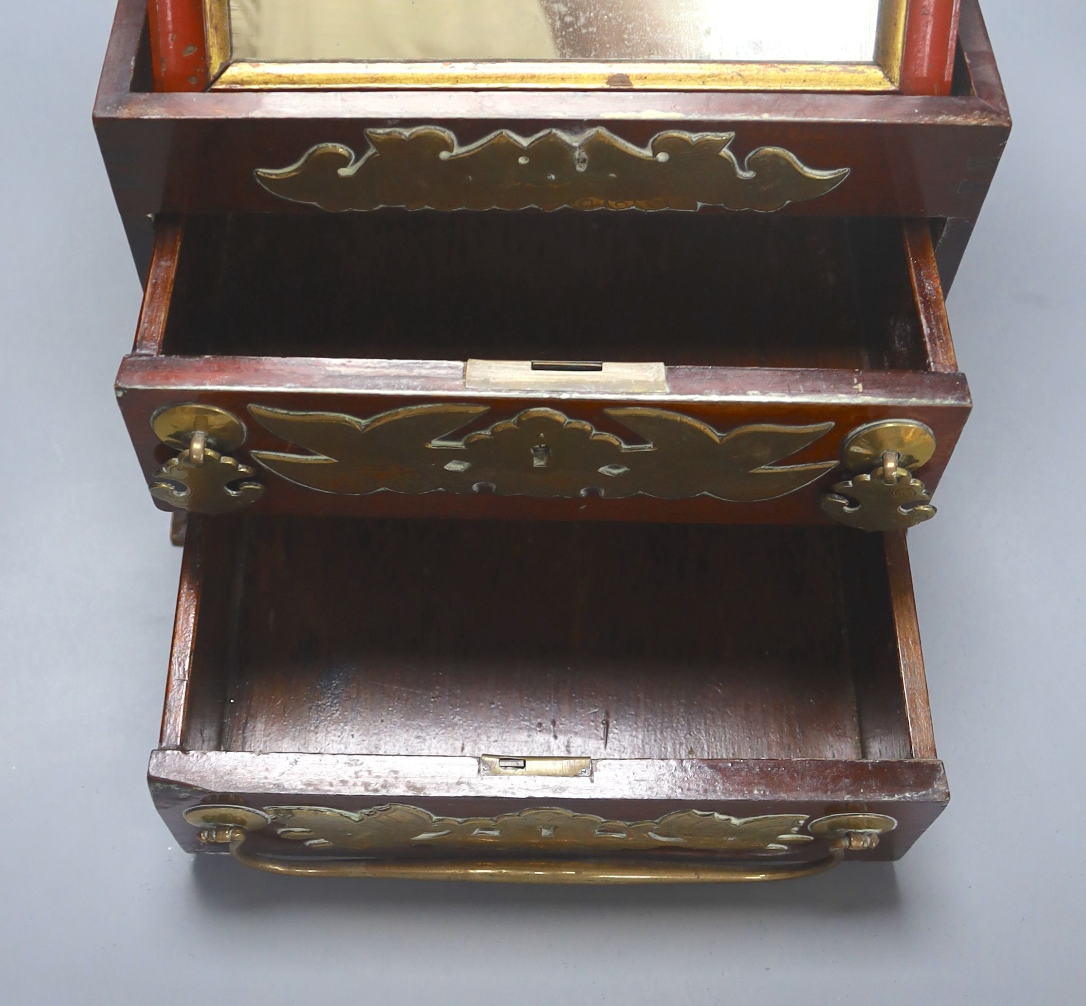 A Chinese brass mounted hardwood dressing table chest, width 28cm height 22cm